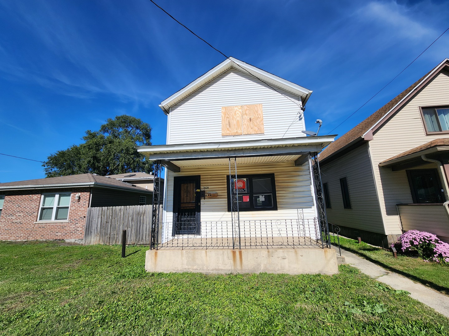 a front view of a house with a porch