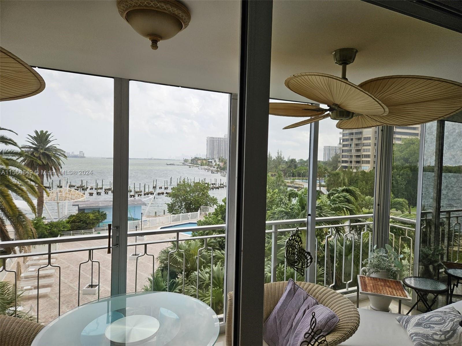 a view of a porch with furniture and a floor to ceiling window