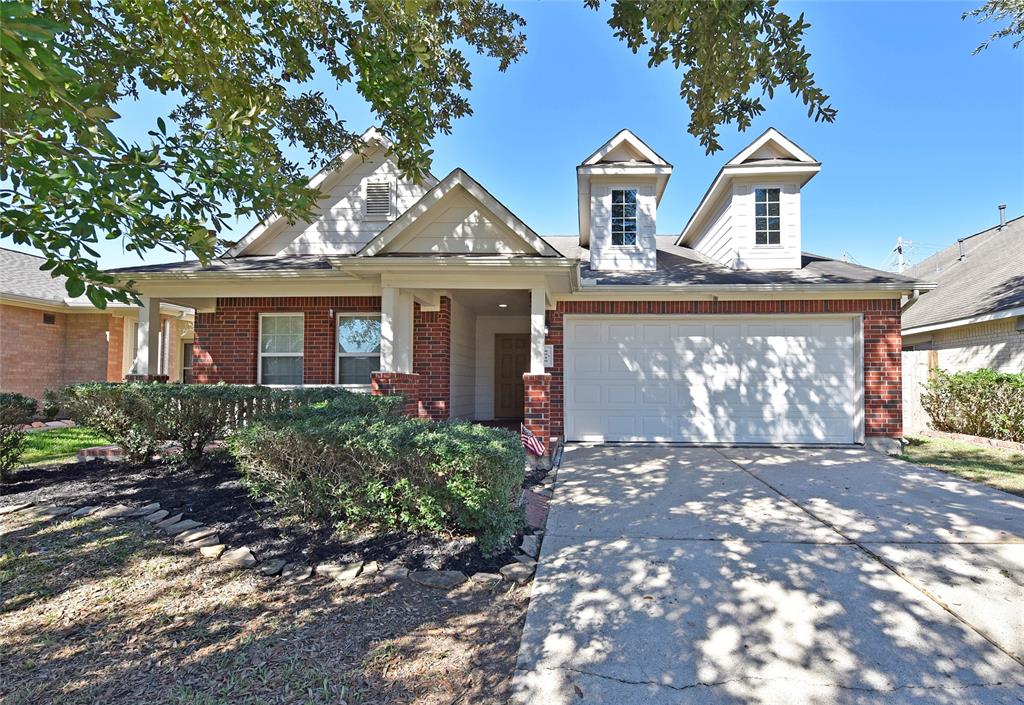 The welcoming covered front porch is perfect for relaxing and adds a touch of warmth to the home's inviting design.