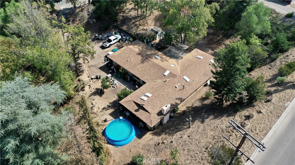 an aerial view of a house with outdoor space