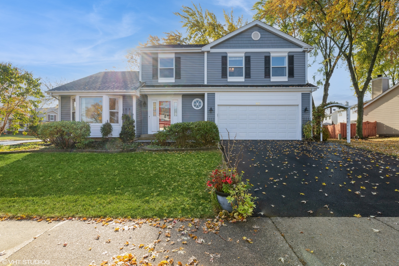 a front view of a house with a garden