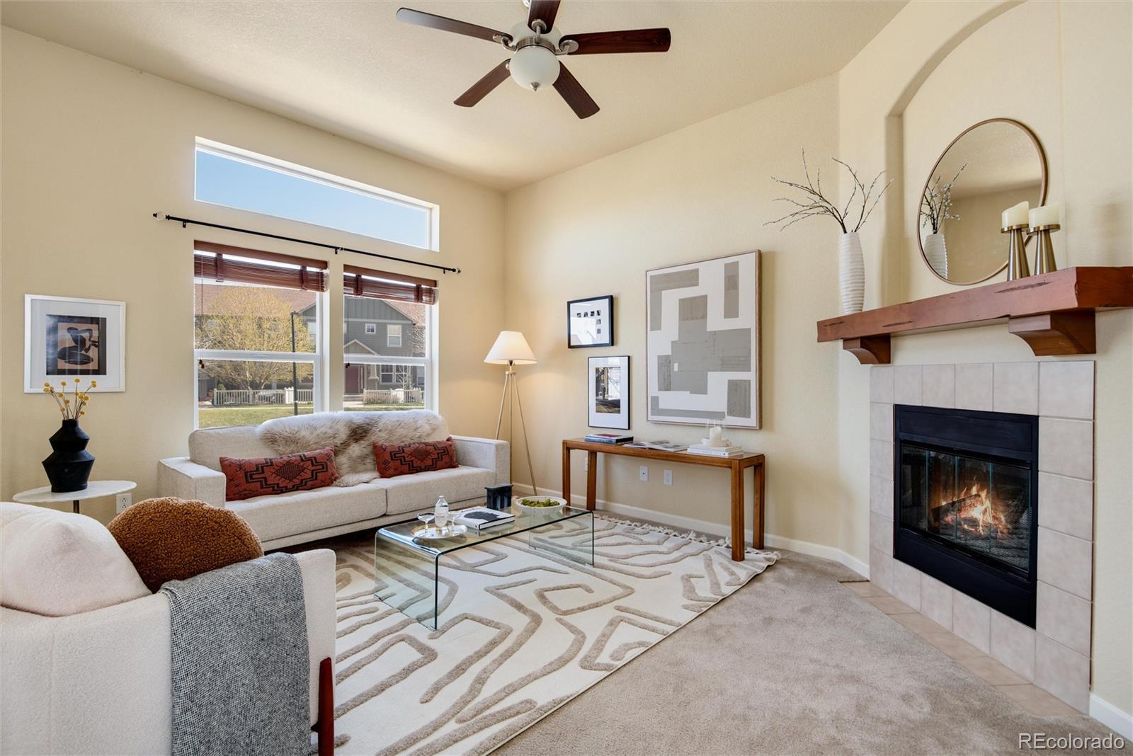 a living room with furniture and a fireplace