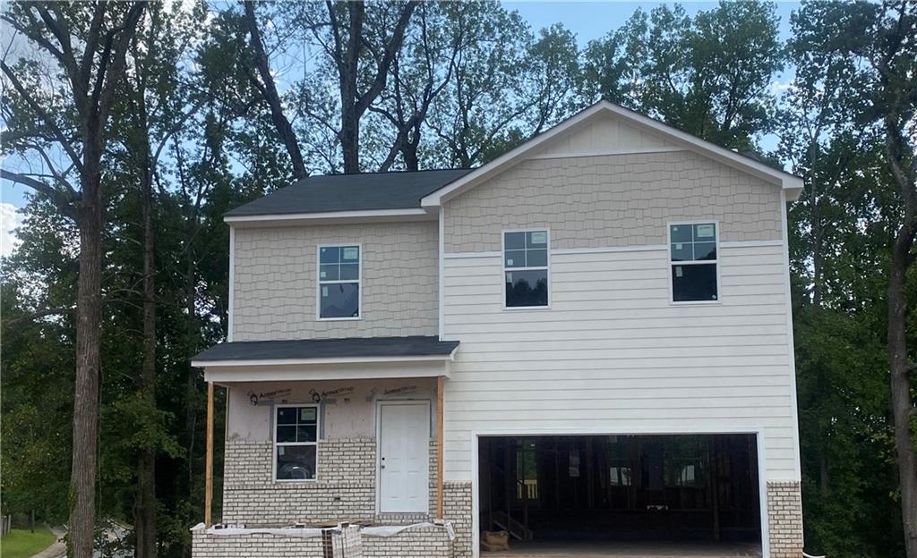 a front view of a house with a garage