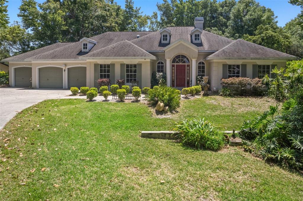 a front view of a house with a yard