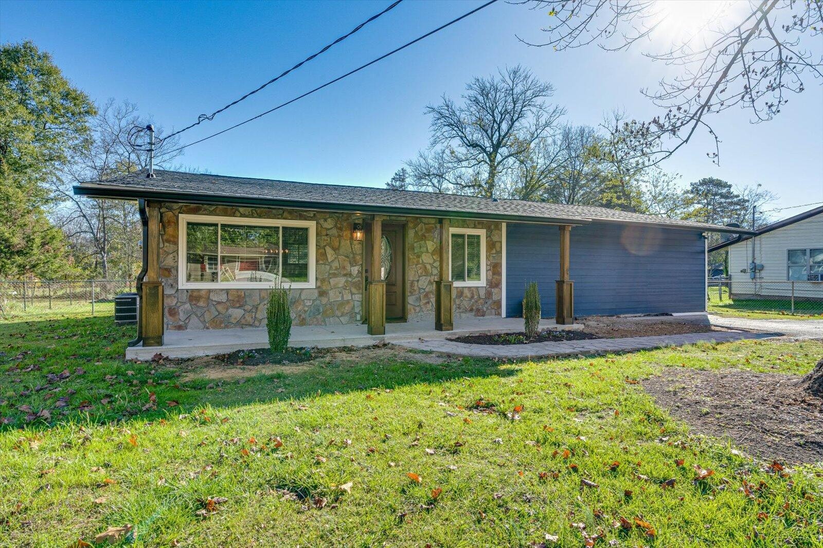 a front view of a house with a yard and porch