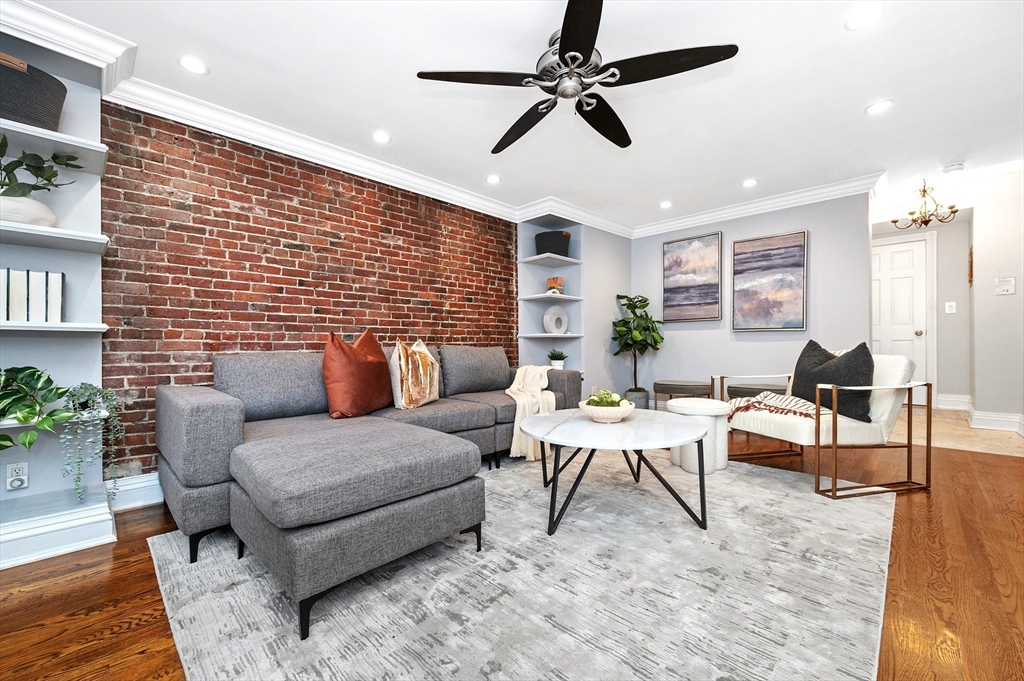 a living room with furniture and a rug