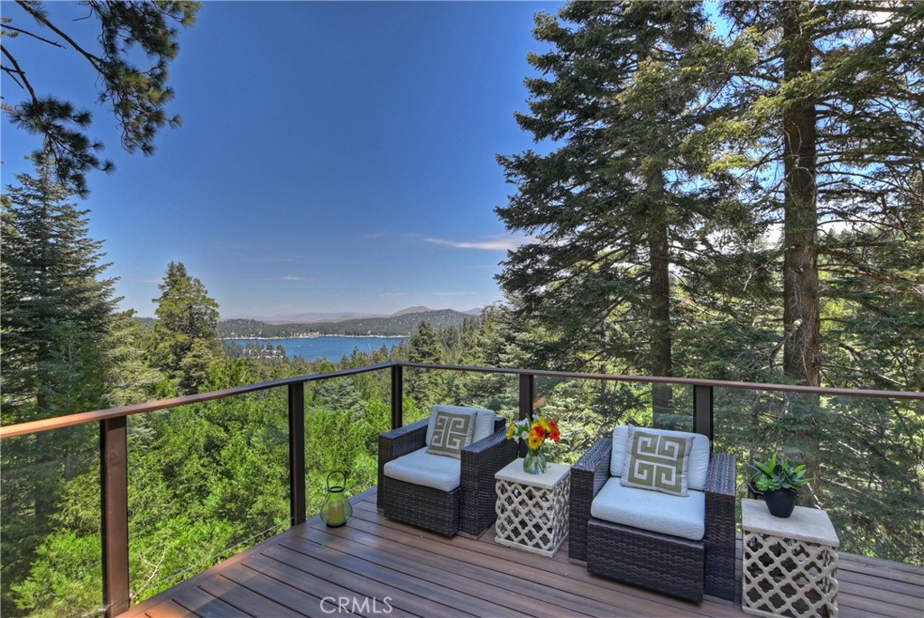 a view of roof deck with couches