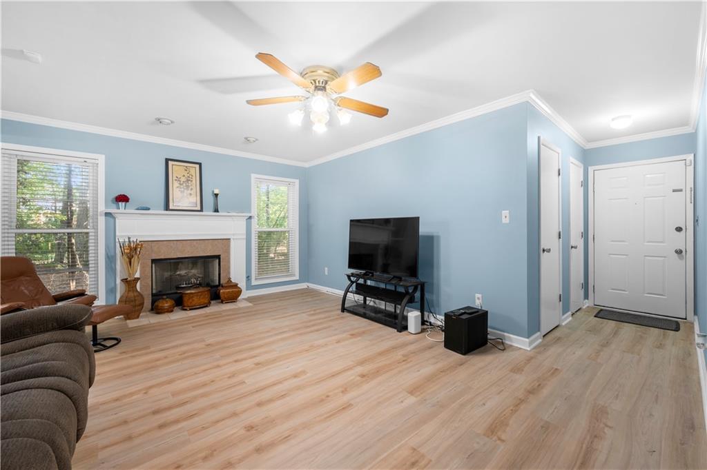 a living room with furniture and a fireplace