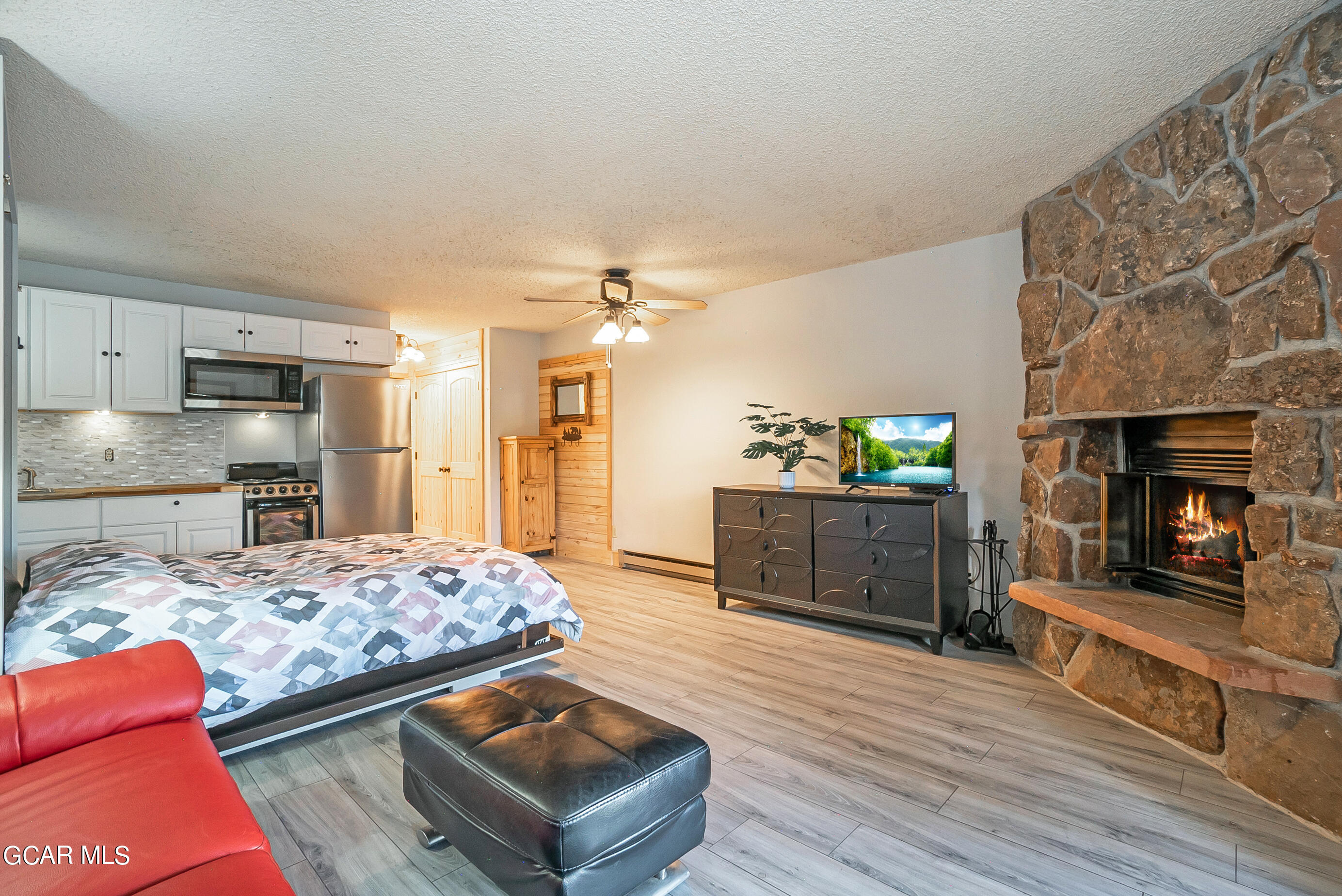 a bedroom with a bed and a fireplace