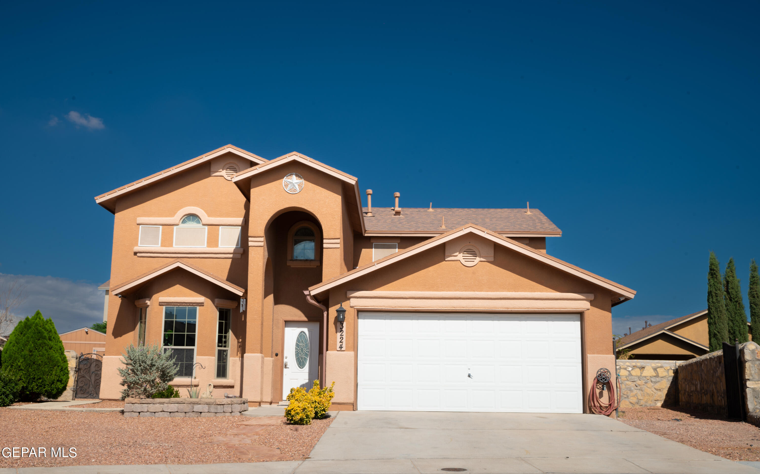 a front view of a house with parking