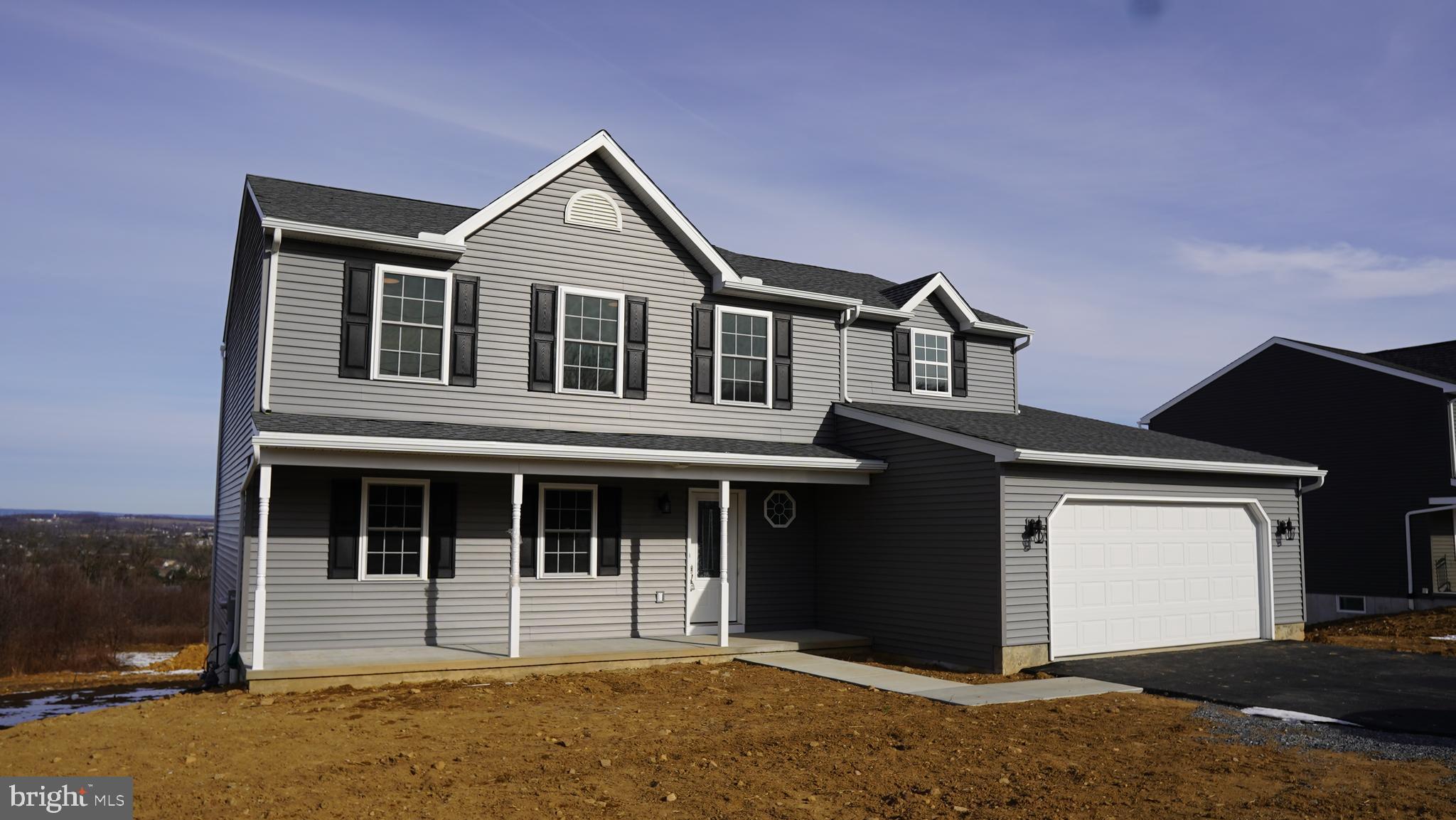 a front view of a house with a porch