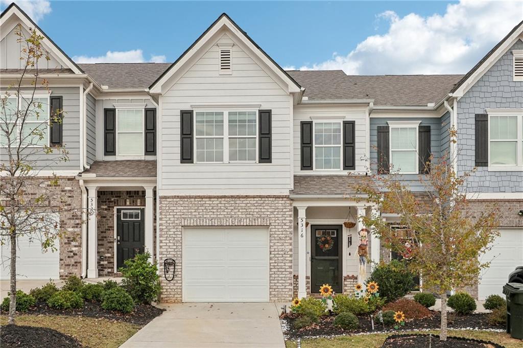 front view of a house with a yard