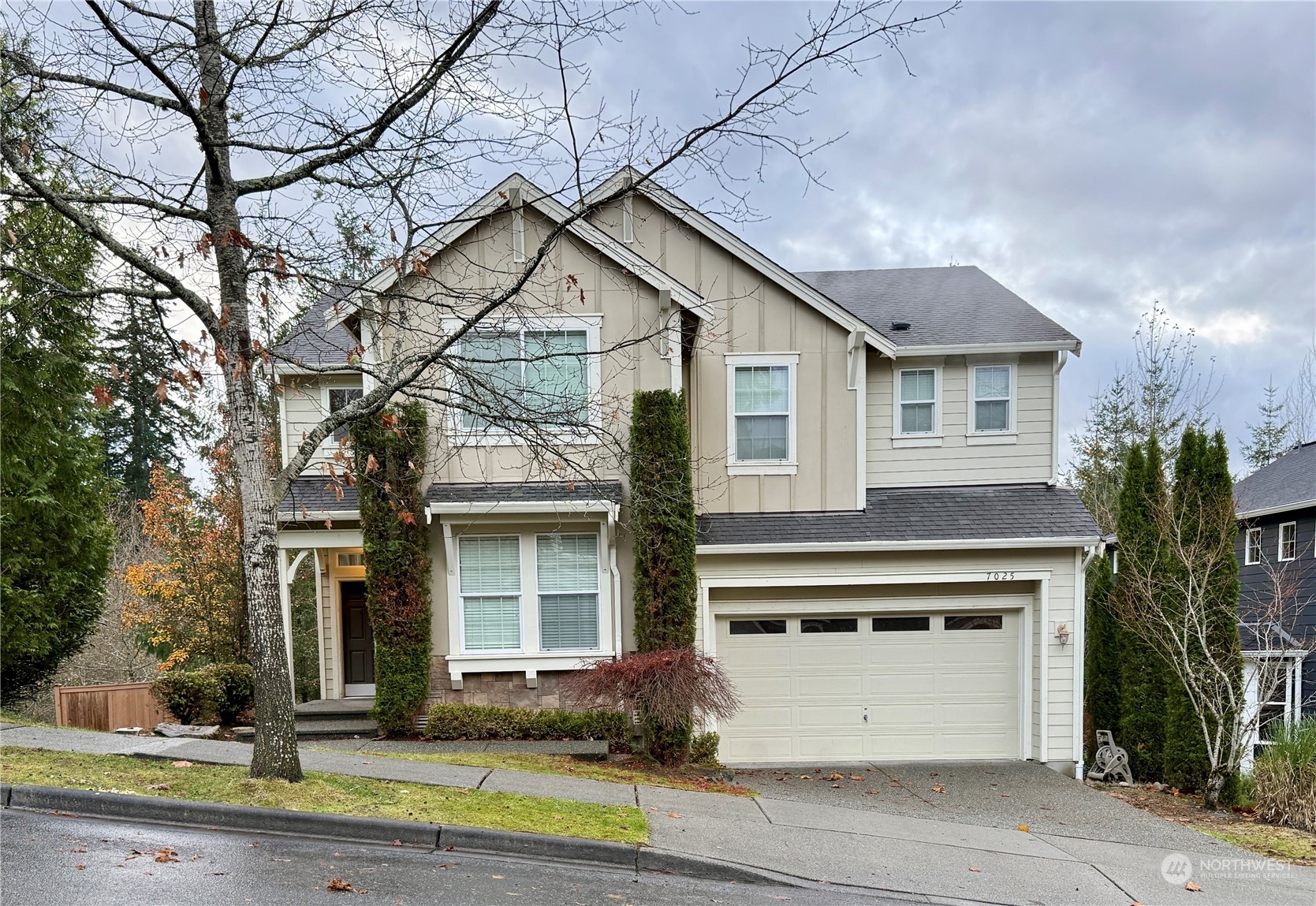 a front view of a house with a yard