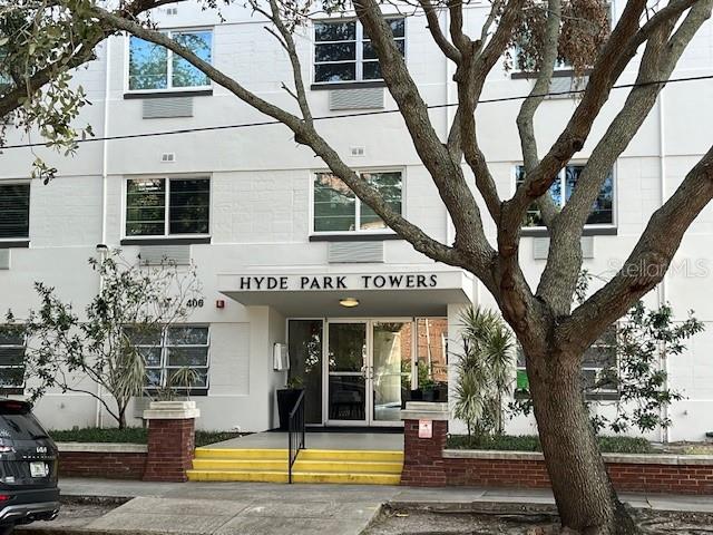 a view of a building with large trees