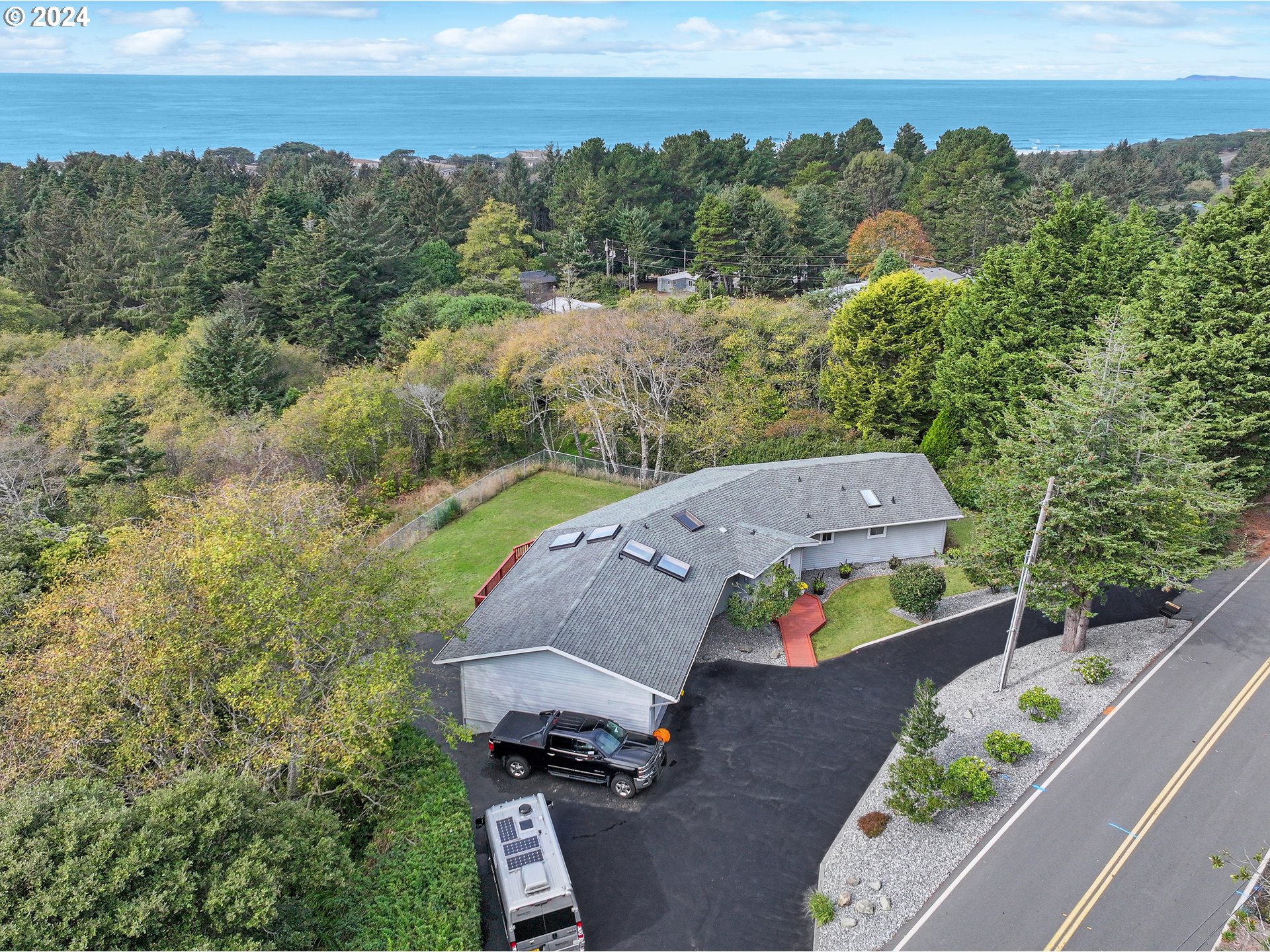 an aerial view of a house with a yard