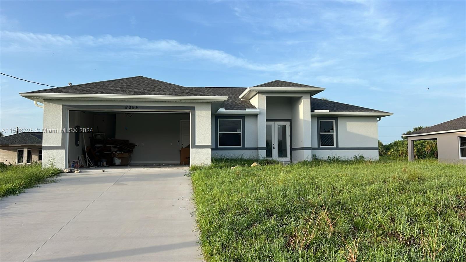 a front view of a house with a yard