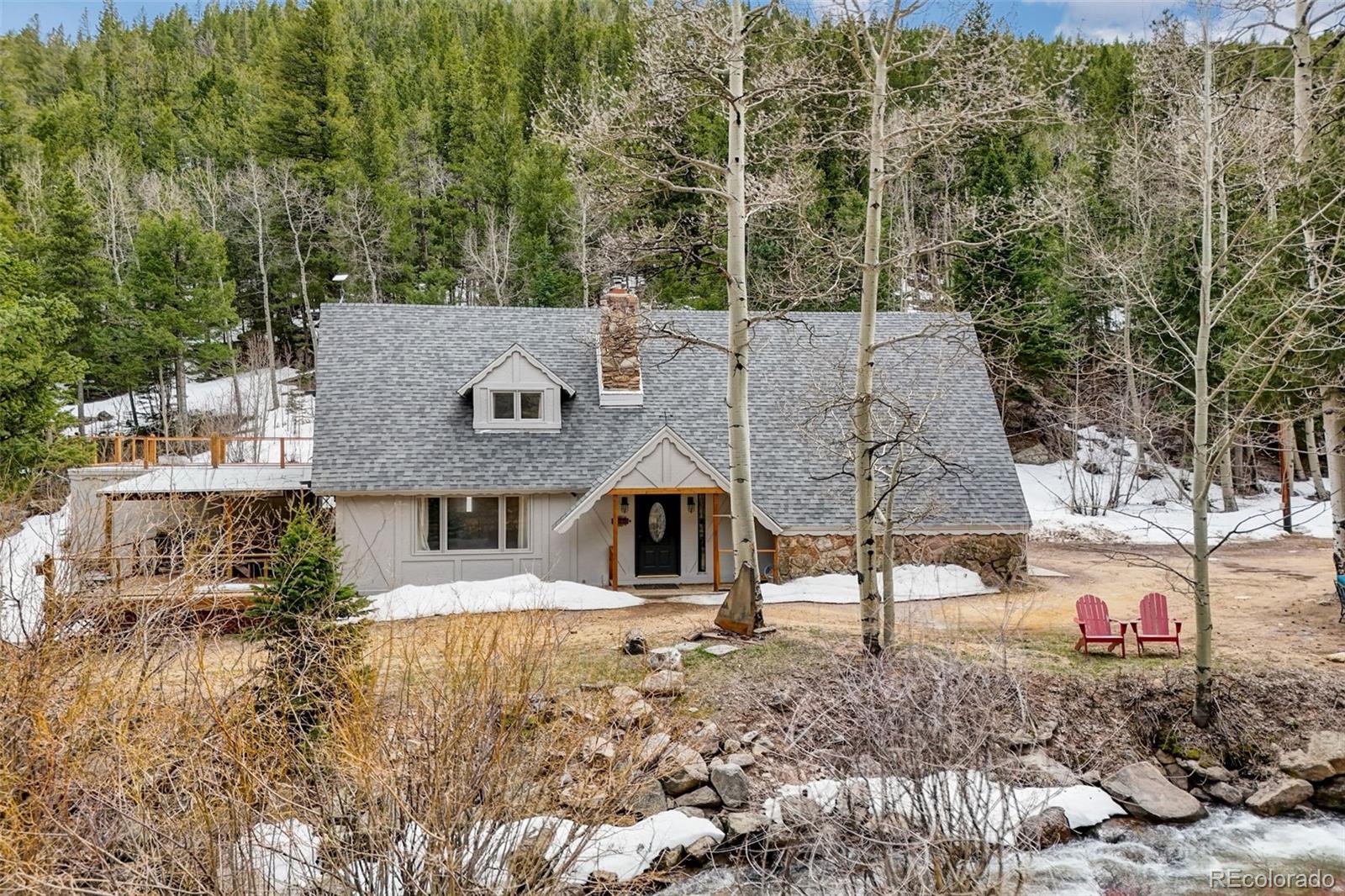 a aerial view of a house with a yard