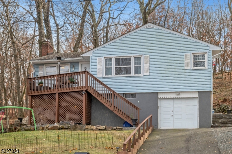 a view of a house with a yard and garage