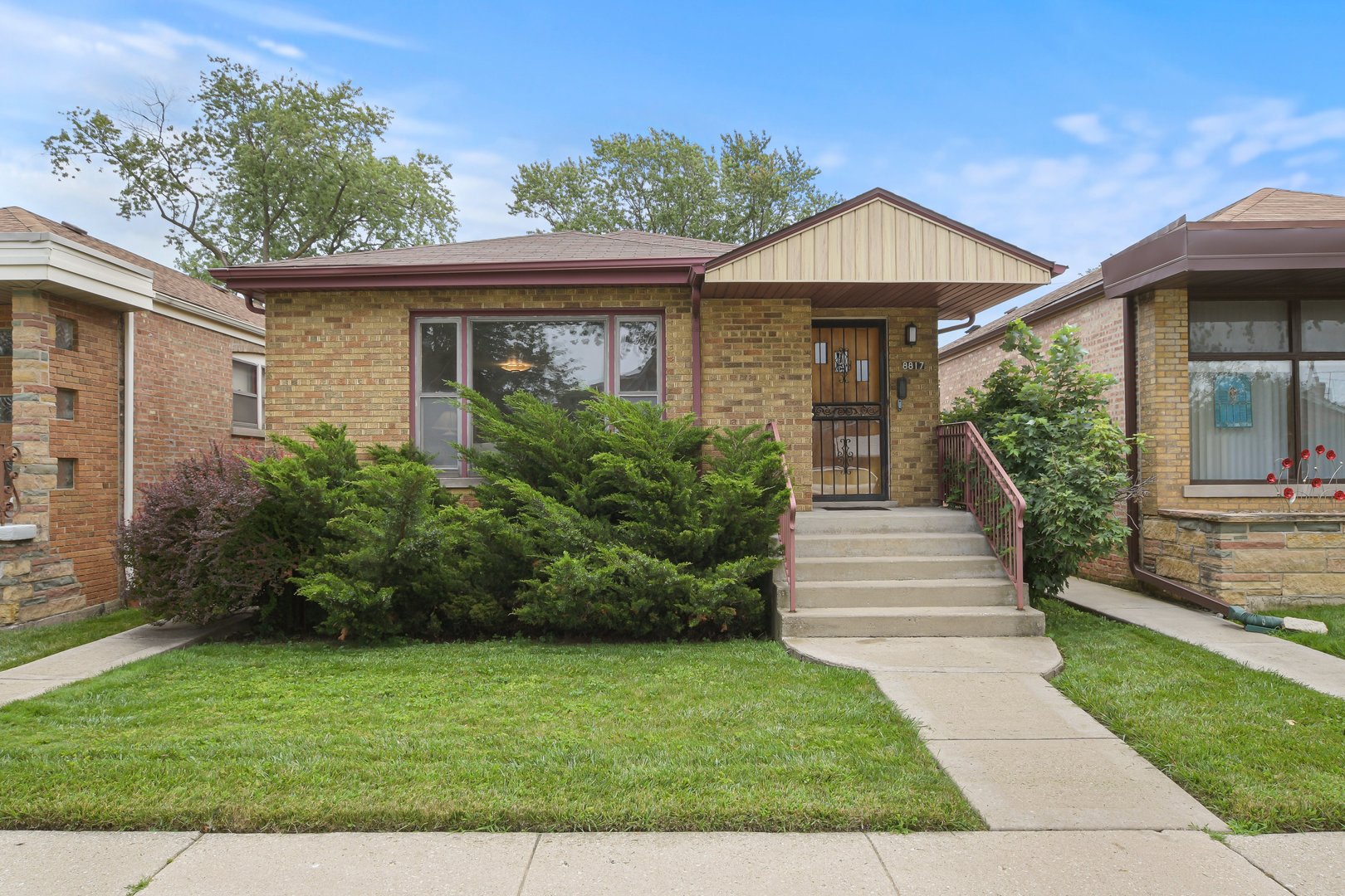 a front view of a house with a yard