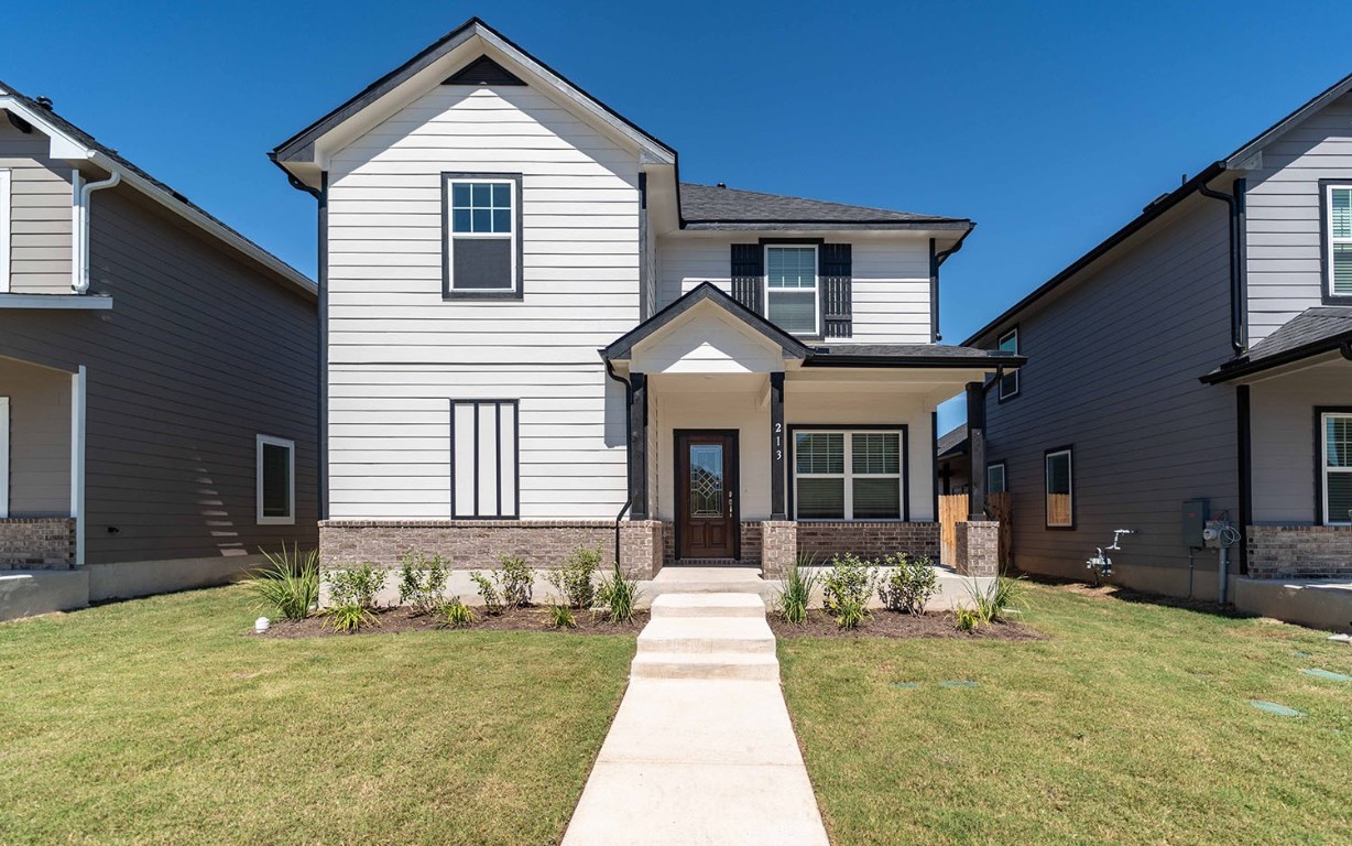 a front view of a house with a yard