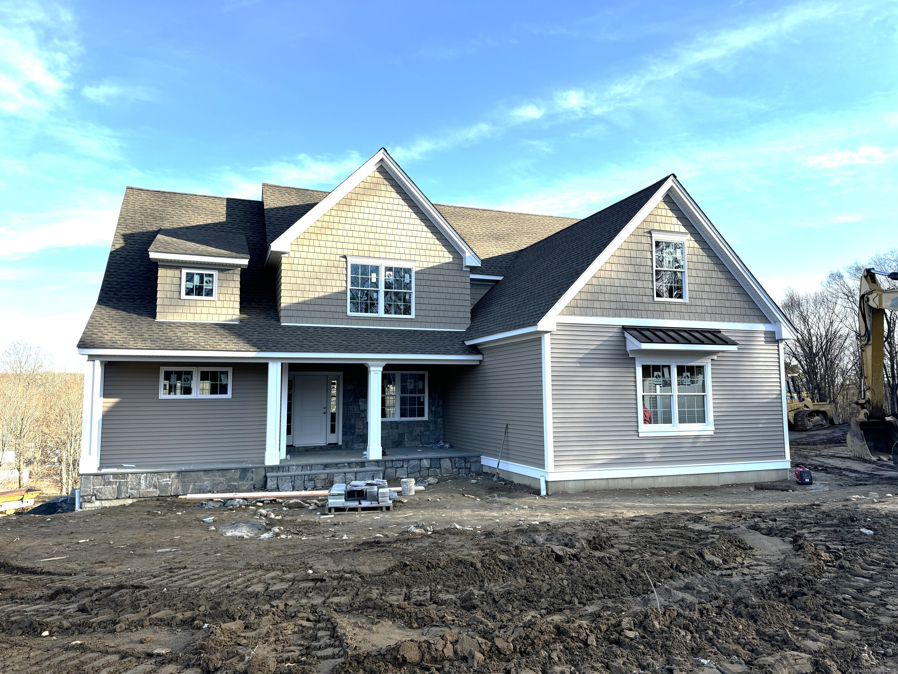 a front view of a house with yard