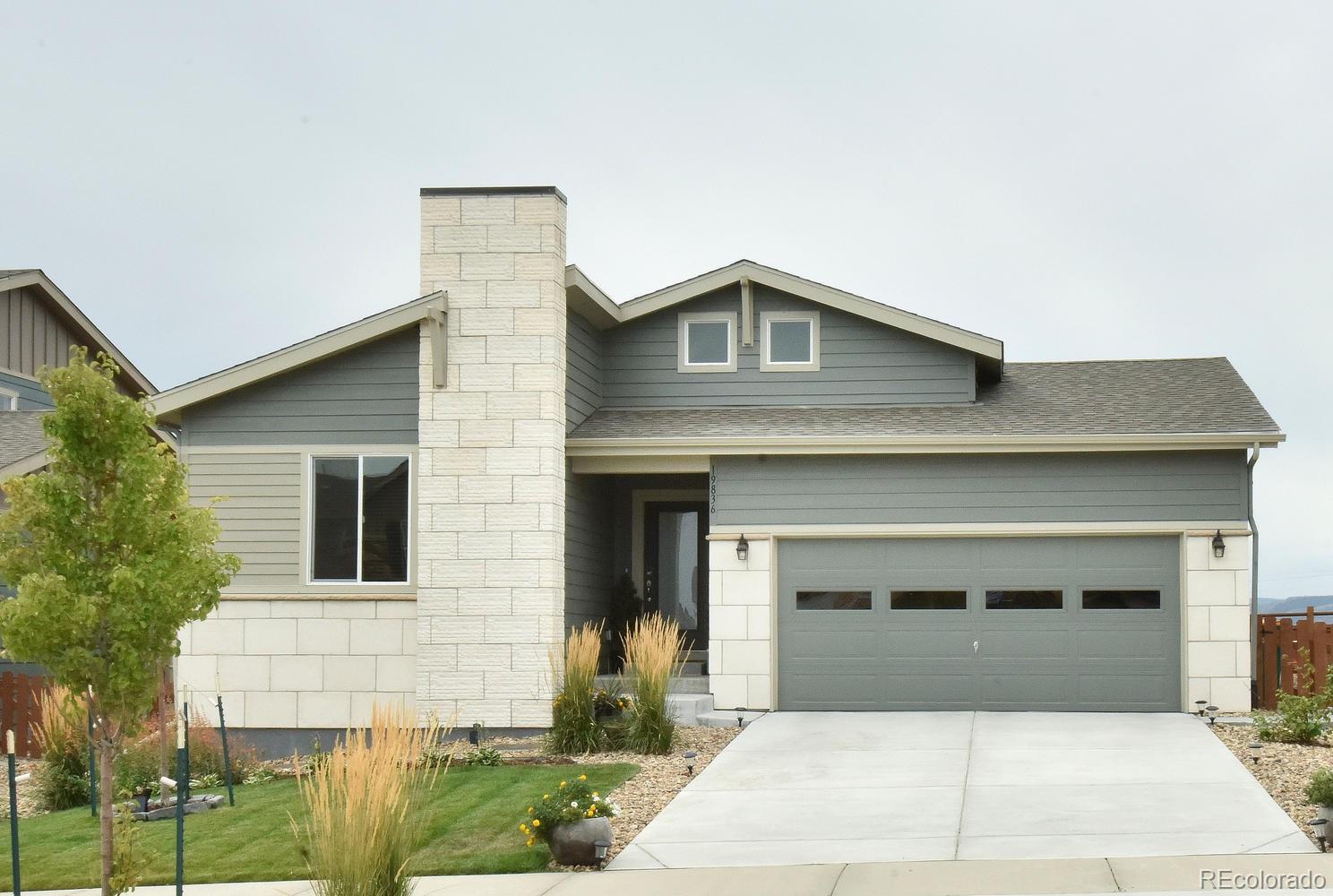 a front view of a house with garage