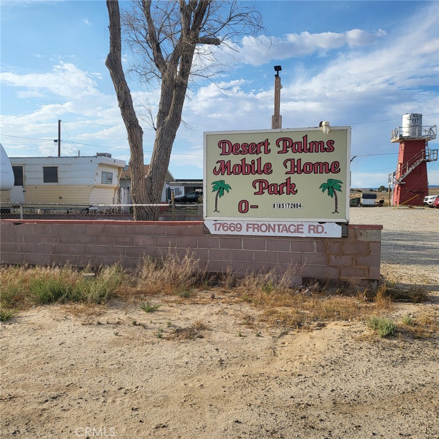 a sign board on the side of a road