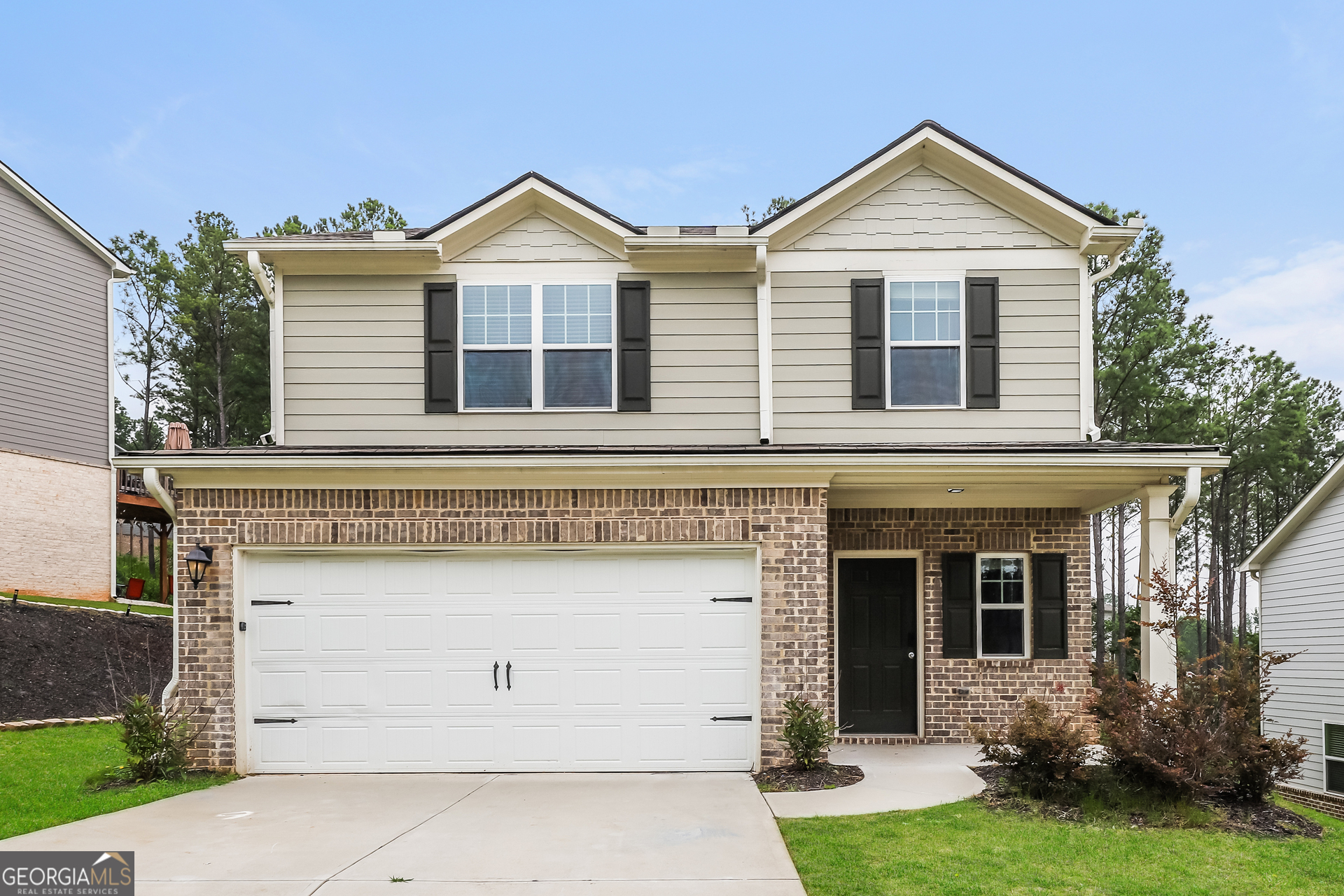 front view of a house with a yard