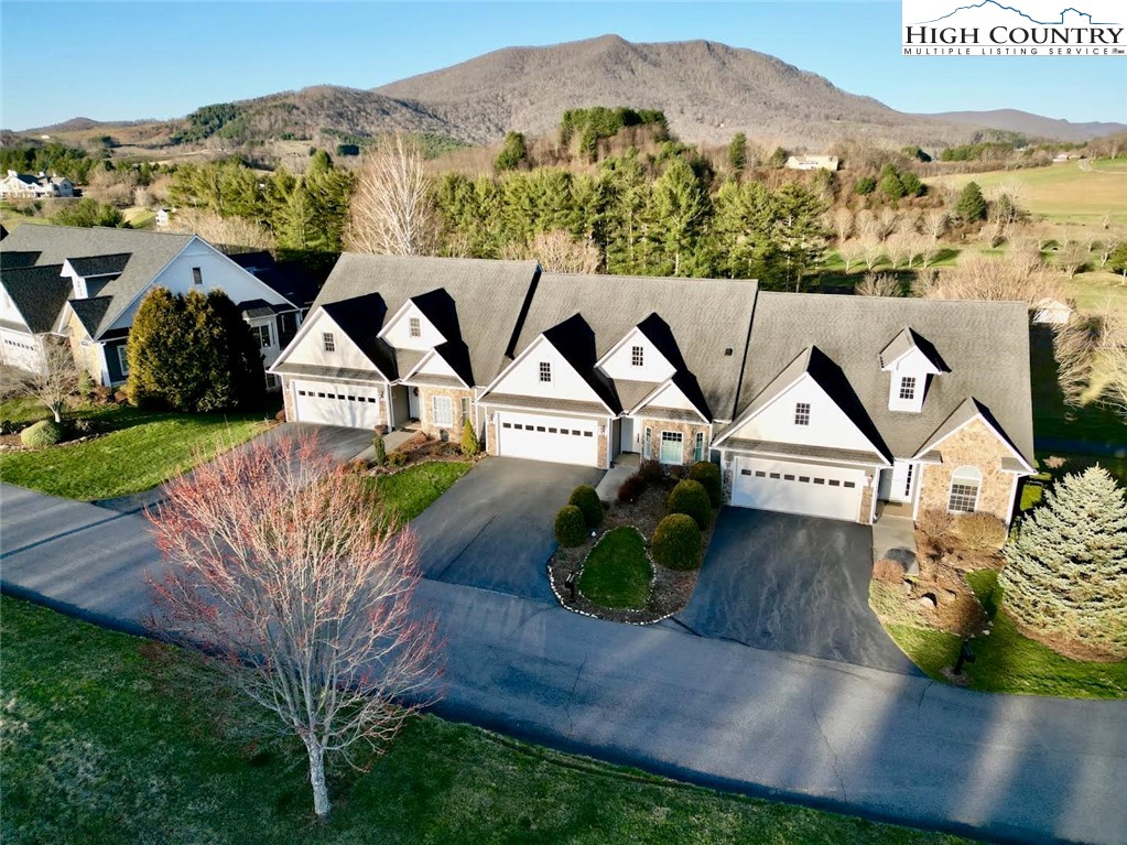 an aerial view of a house with a garden