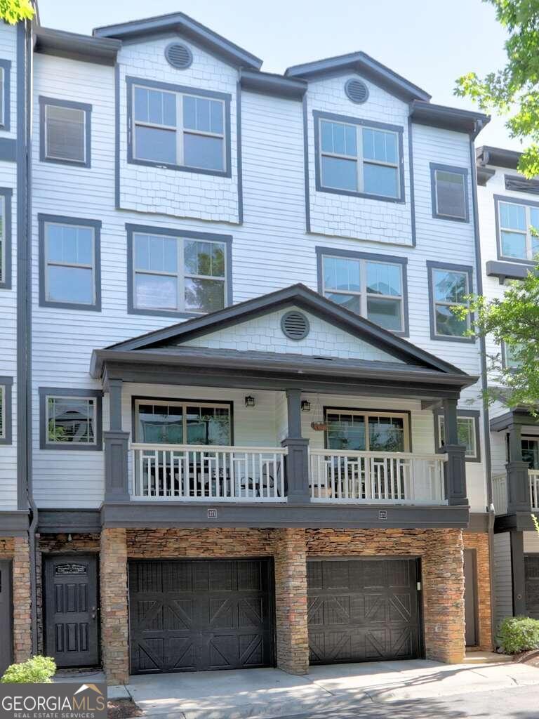 a front view of a house with balcony