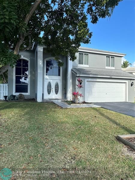 front view of a house with a yard