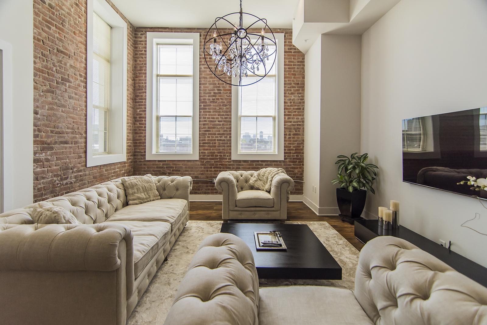 a living room with furniture or couch and a flat screen tv