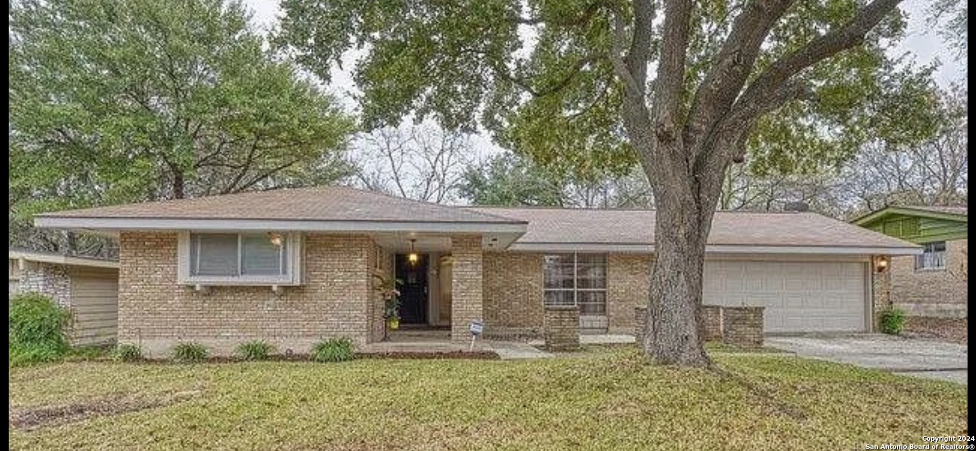 front view of a house with a yard