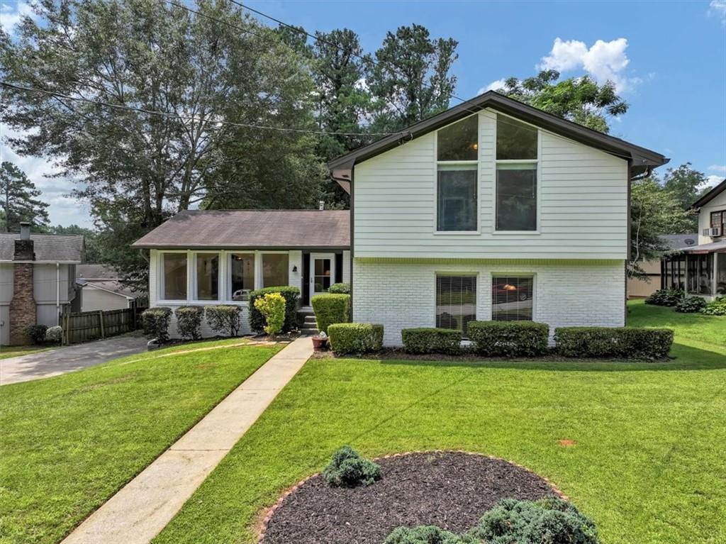 a front view of a house with a yard