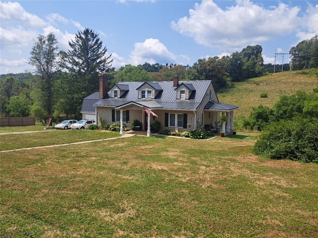 a front view of house with outdoor space and swimming pool