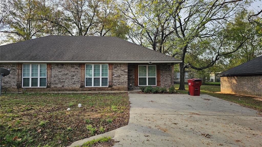 front view of a house with a yard