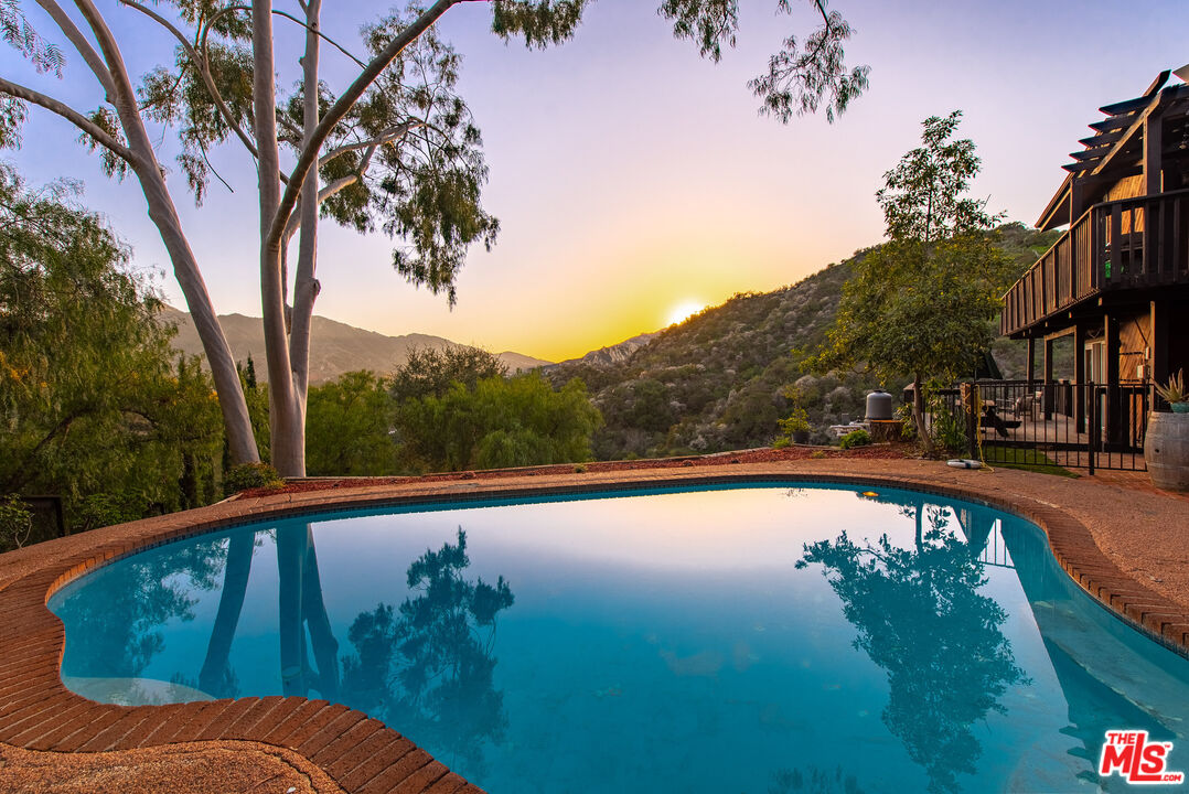 a view of swimming pool from a balcony