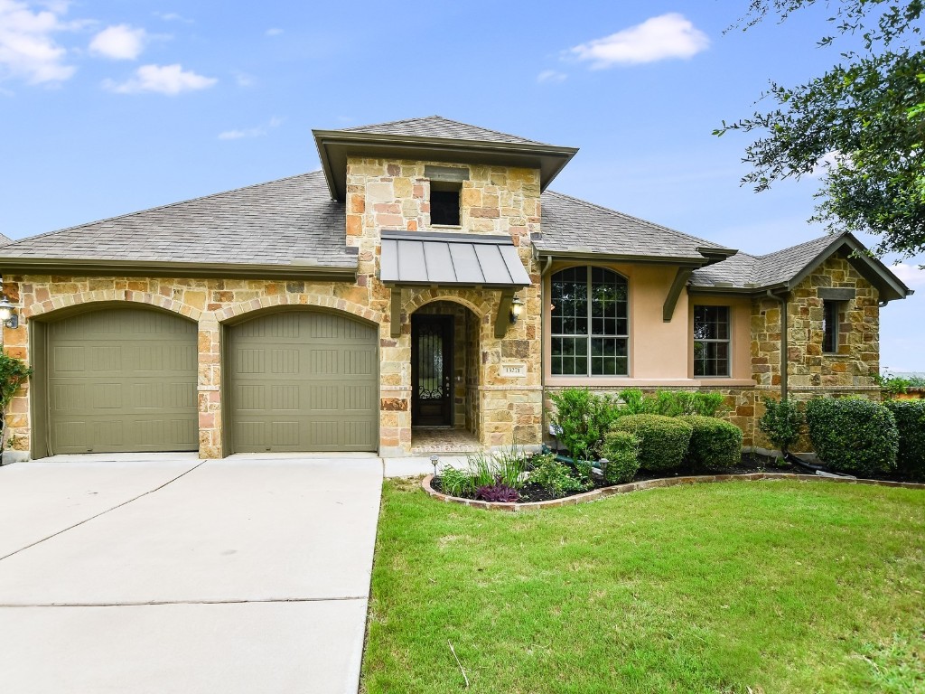 Nestled on a prime greenbelt lot in the highly sought-after Belterra community, this beautiful 1.5-story home is a must-see.