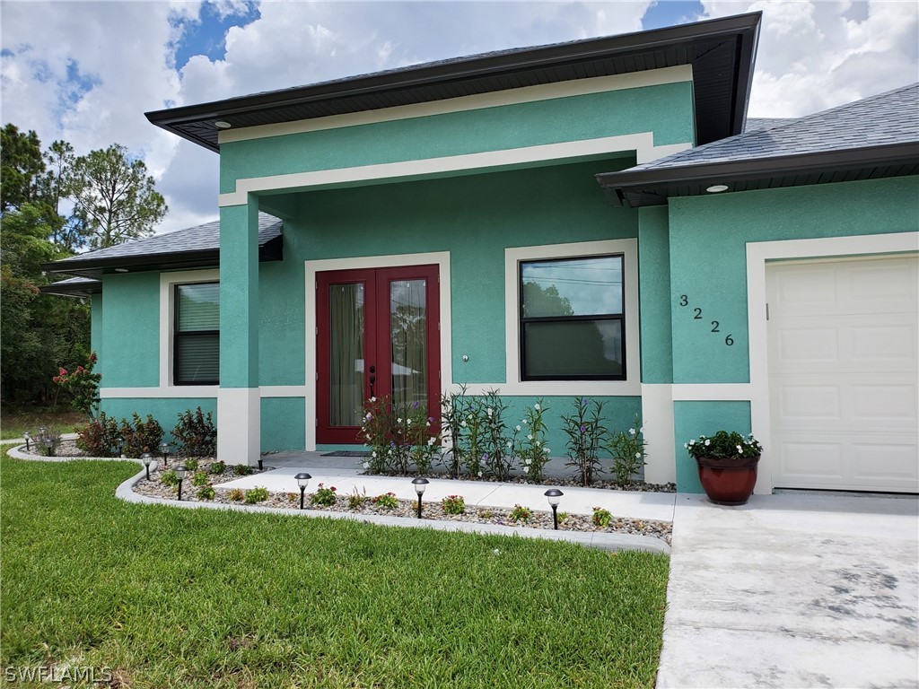 a front view of a house with a yard