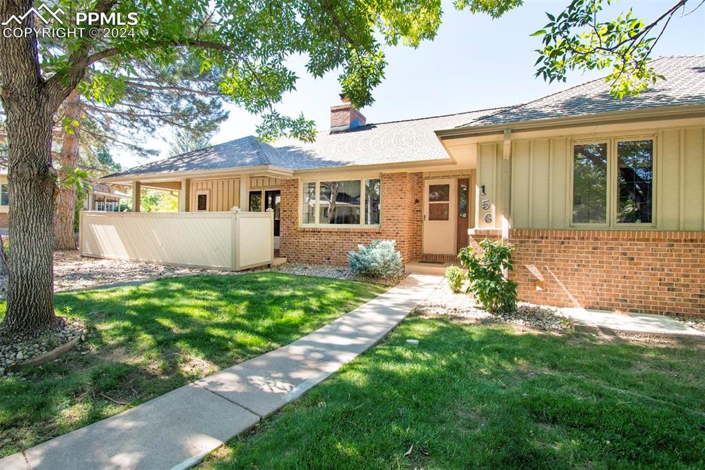 front view of a house with a yard