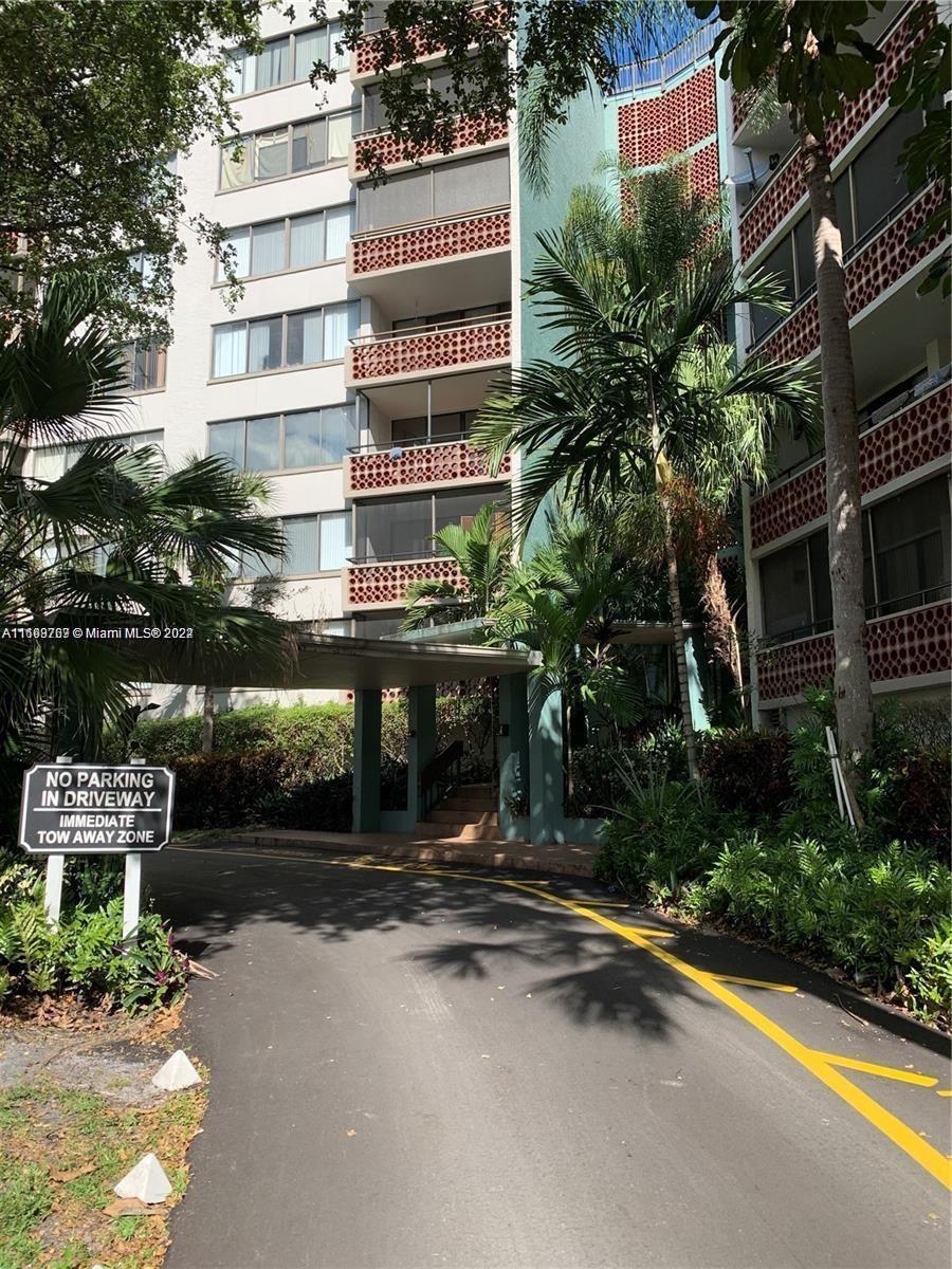 a front view of a building with garden