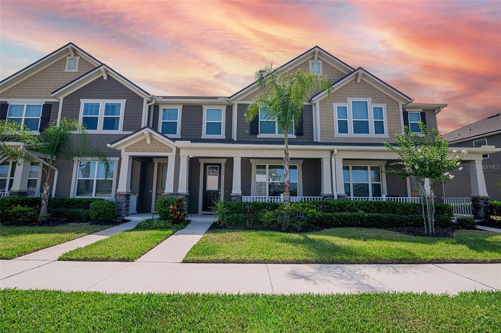 a front view of a house with a yard