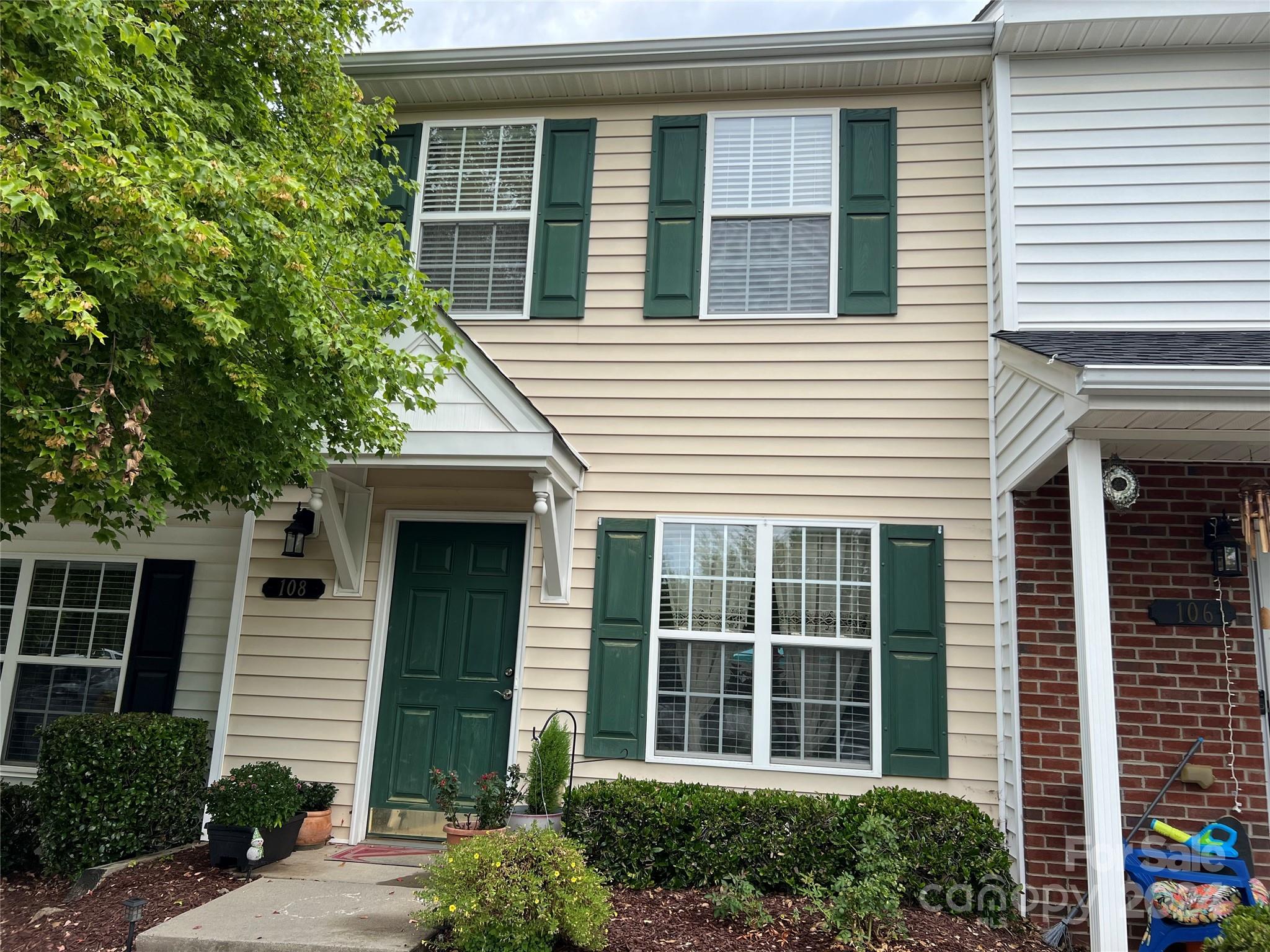 a view of a house with a window and balcony