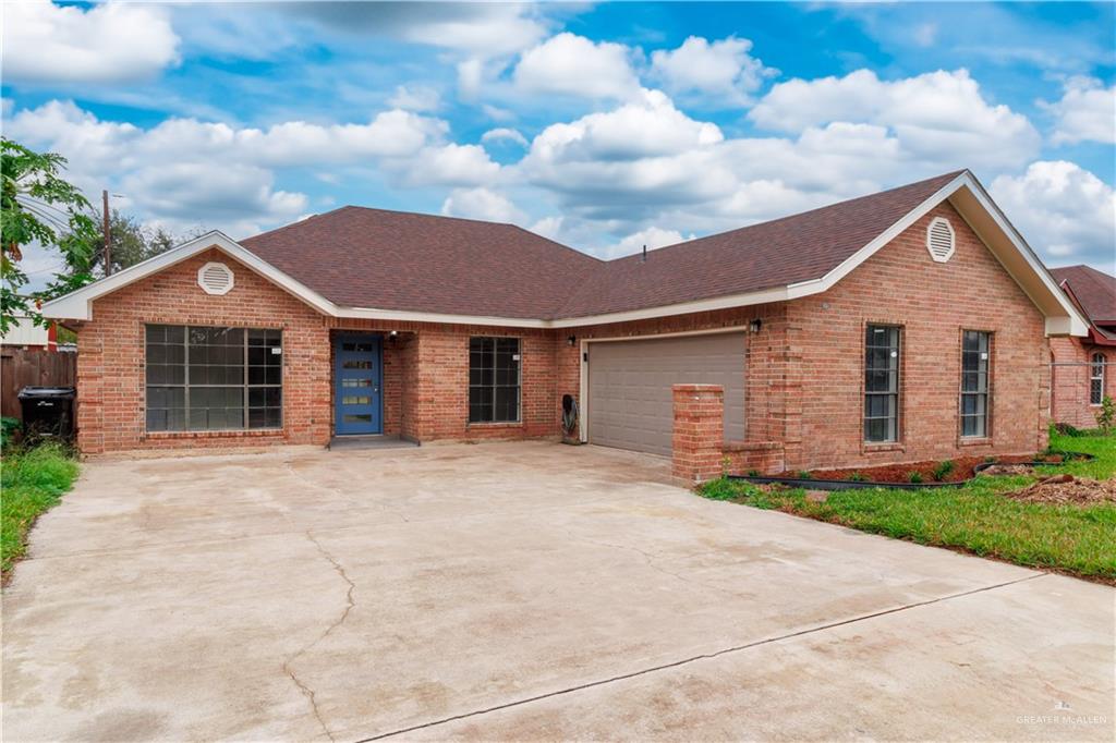 Single story home with a garage