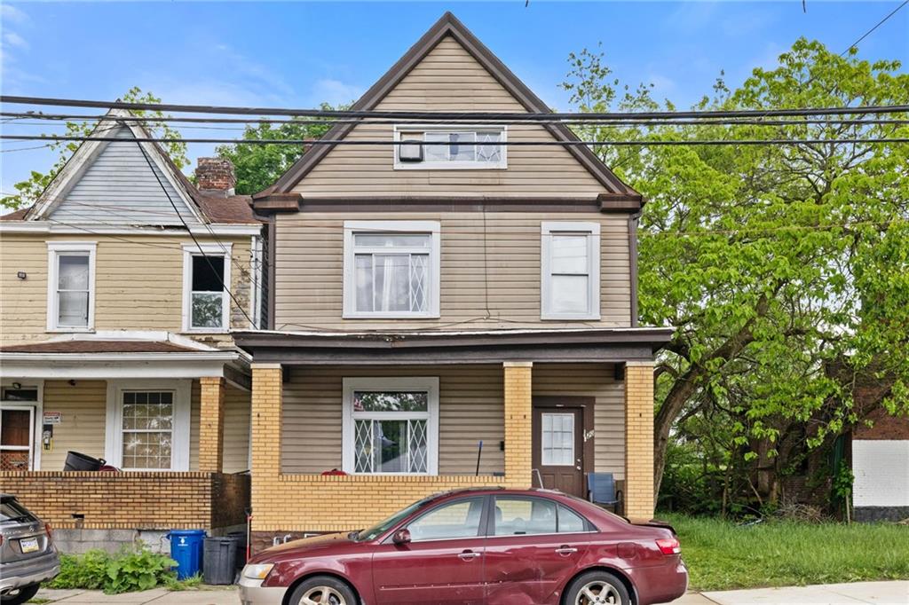 a front view of a house with a yard