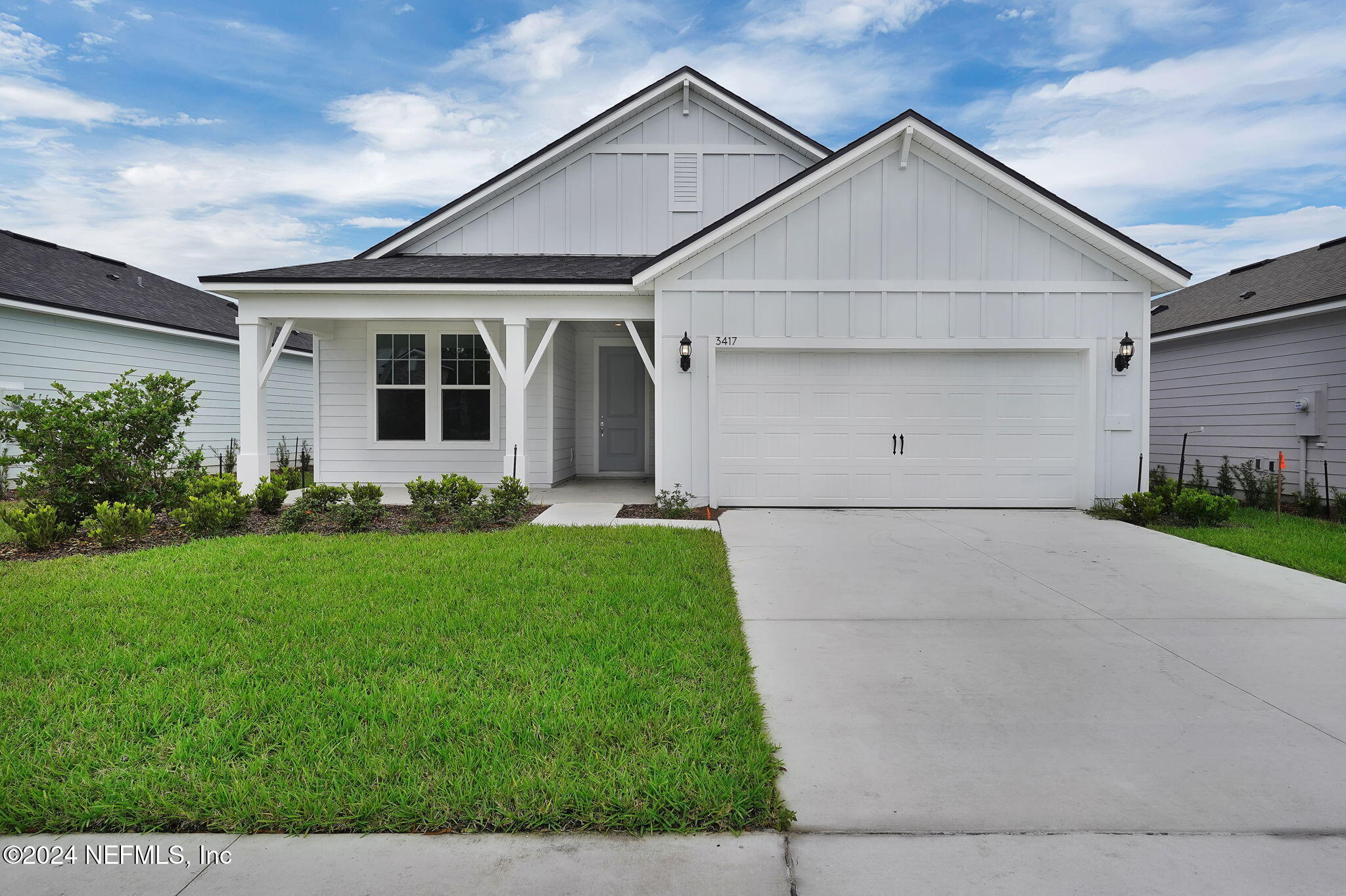 a view of a yard in front view of a house