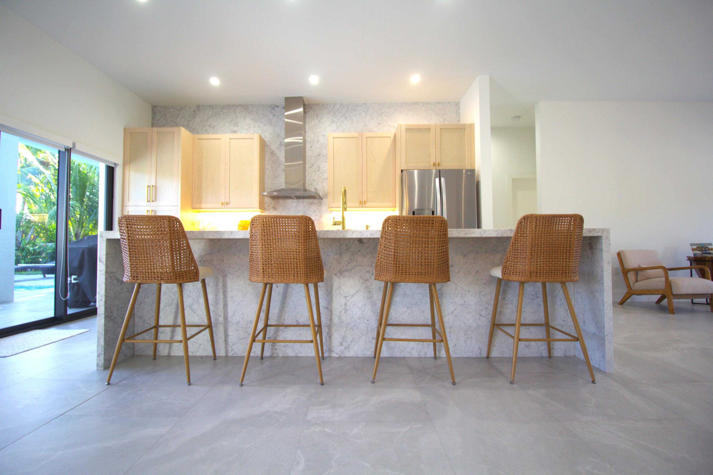 a view of kitchen with dining table and chairs