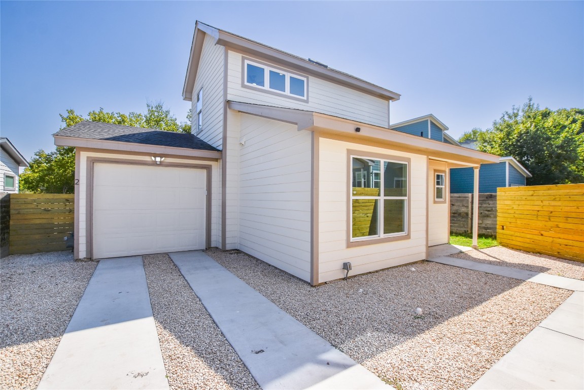 a front view of a house with a garage