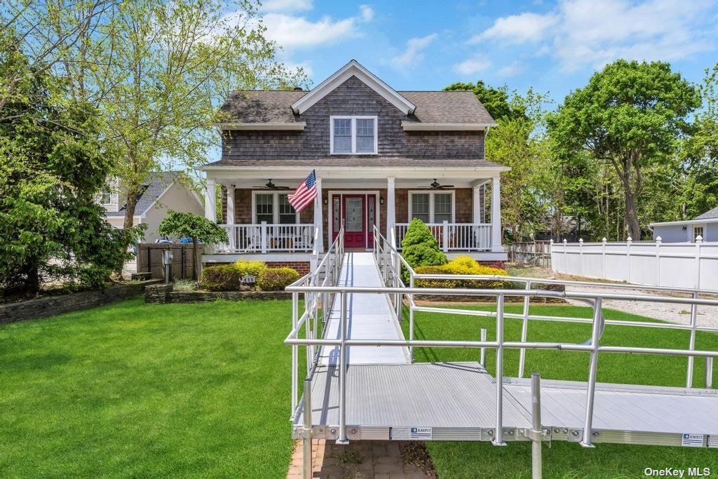 a view of a house with a swimming pool and a big yard