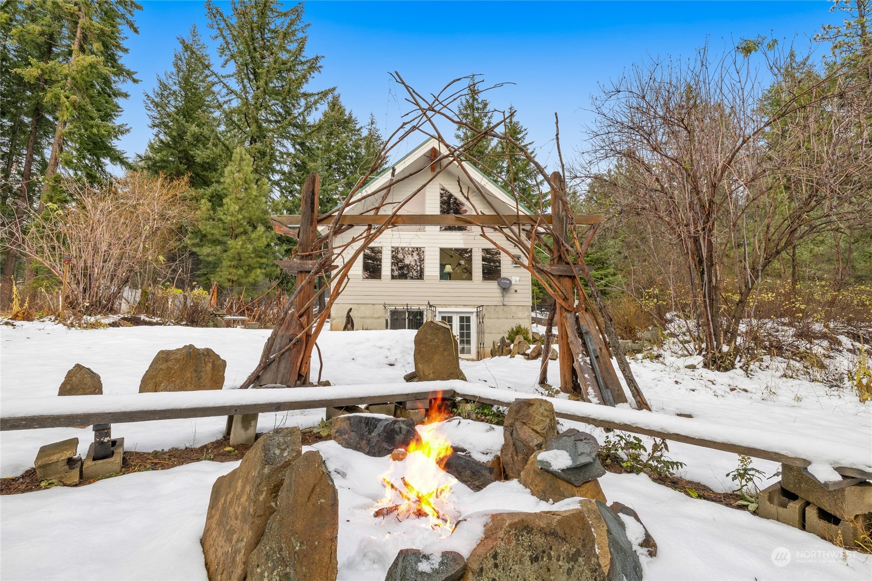 a view of a house with snow on the background